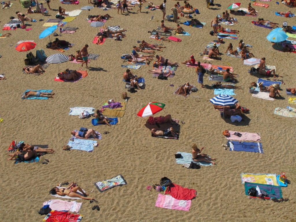 Umbrellas and towels on the beach in Biarritz France