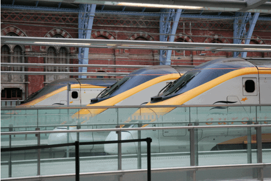 Front ends of three Eurostar Trains at St Pancras station with red brick walls in the background