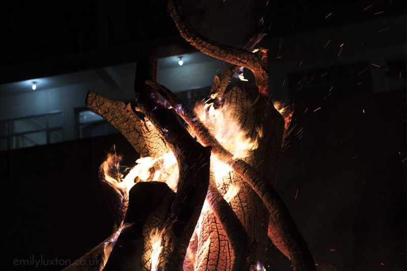 Close up of a log bonfire burning at night at Holika Dahan in Rishikesh