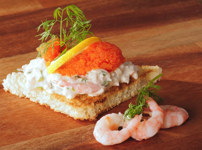 Toast Skagen - a traditional swedish food made with prawns, roe, and sauteed bread