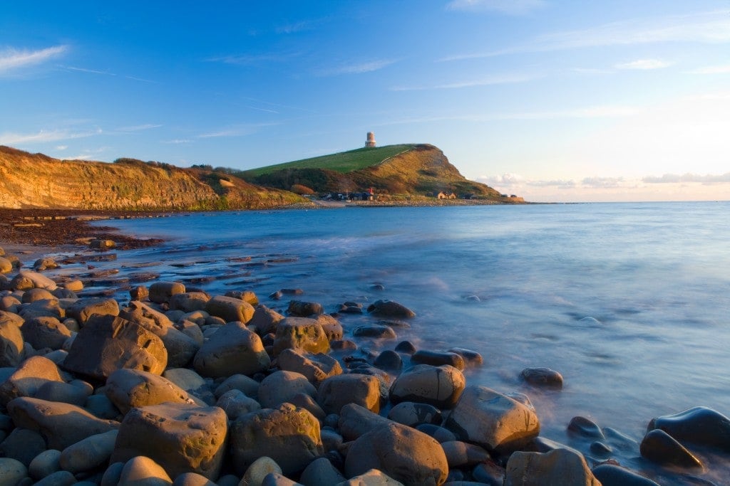 Chesil Beach. 21st August 2018. Two males enjoy swimming off Chesil Beach,  Portland, in Dorset, the