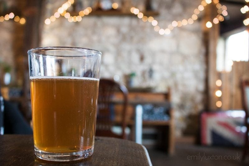 beer on a table with boke background