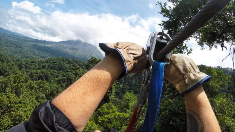 zip lining in front of Arenal in La Fortuna Costa Rica