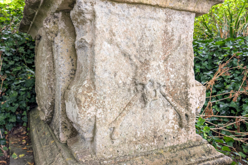 Stone grave with a skull and crossbones carved into it