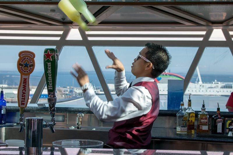 Bartender mixing cocktails on a cruise ship