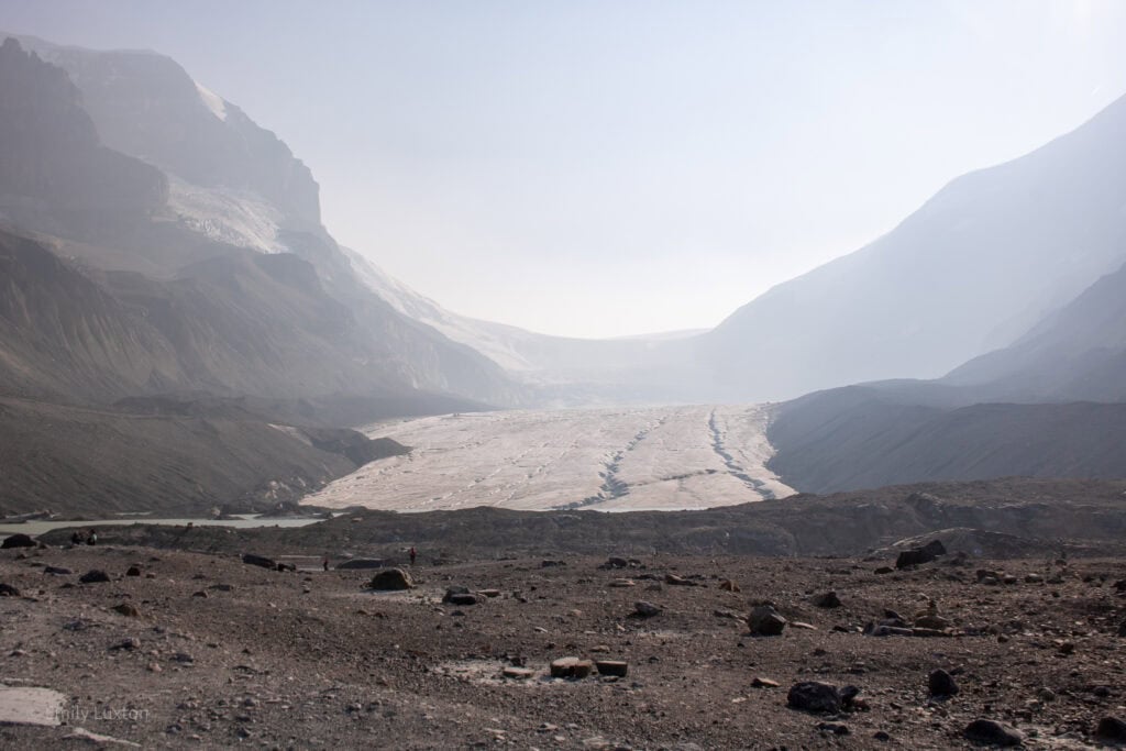 view of a glacier with exposed rock on either side
