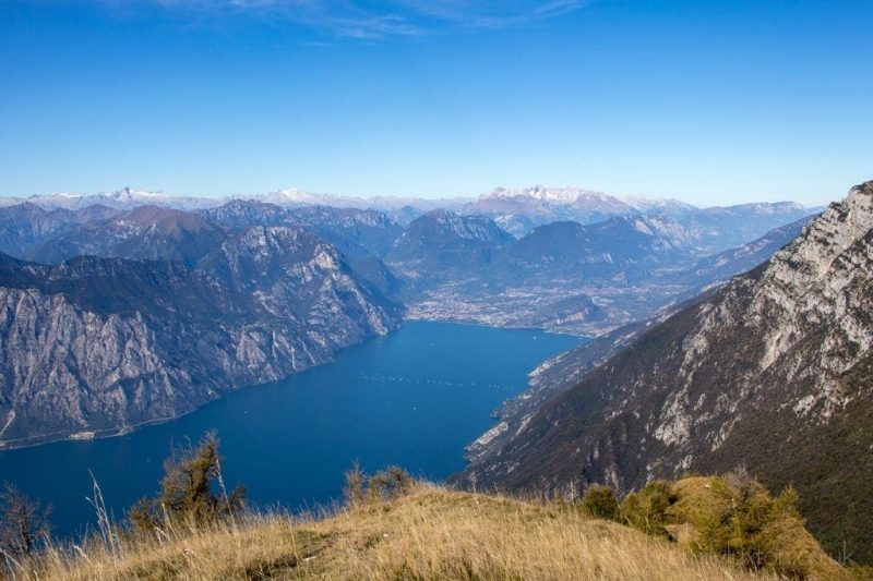 aerial view of Lake Garda surrounded by mountains in italy, a popular place for walking holidays 