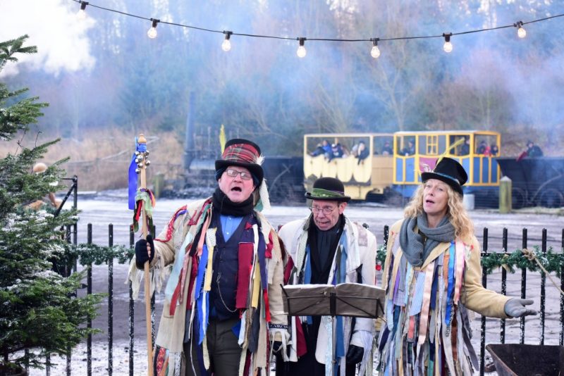 christmas carollers at traditional festival
