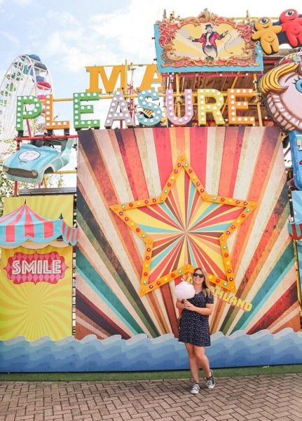 Girl with candyfloss at a fairground