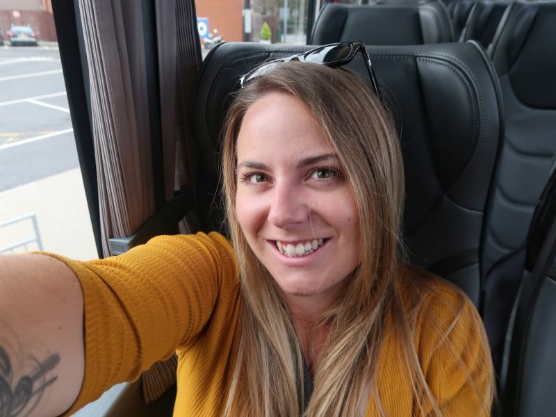 Girl in yellow dress on National Express Coach
