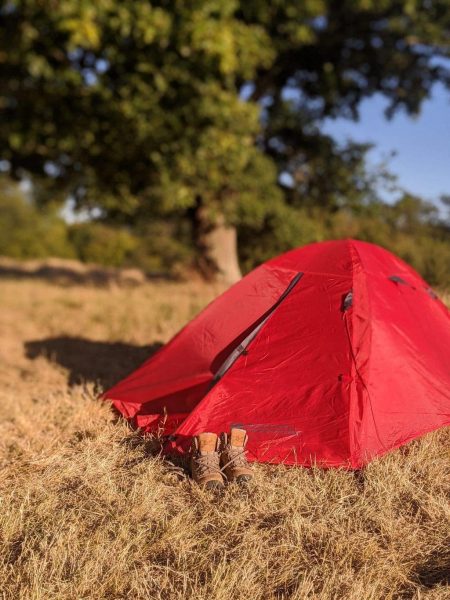 Hiking boots and tent