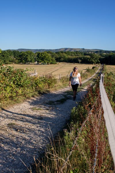 Travel Blogger Emily Luxton walking at Clarefield Copse Campsite