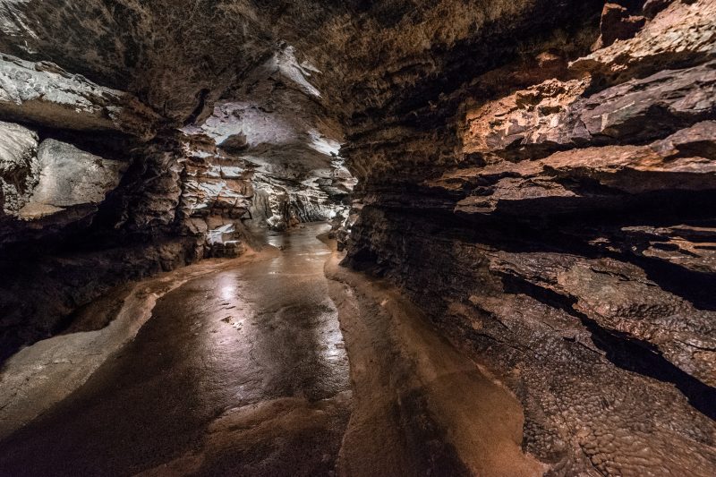 Tunnel inside a cave at the National Showcaves Centre in Wales