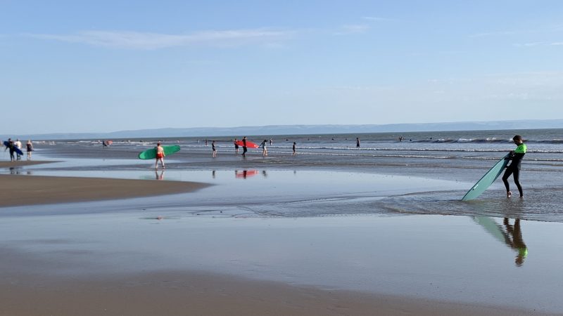 Surfers on Porthcawl Beach