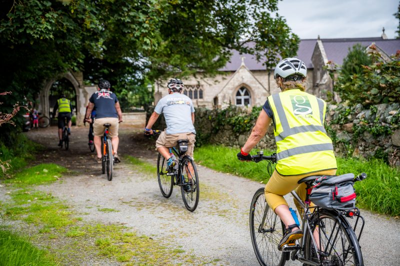 Cycling past a church in Anglsey Wales