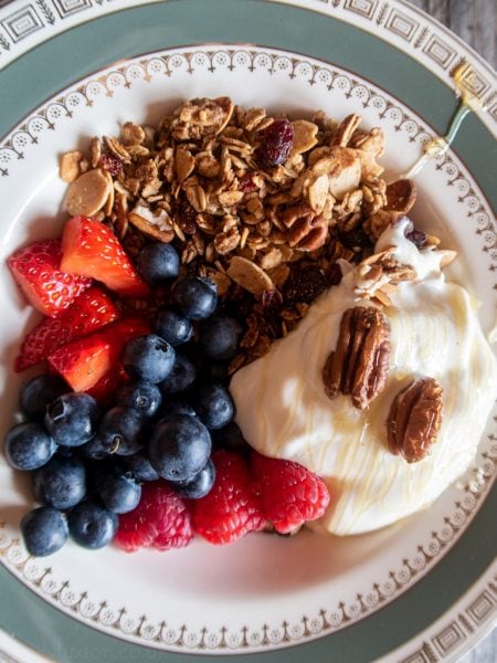 Flat lay of breakfast granola yoghurt and berries