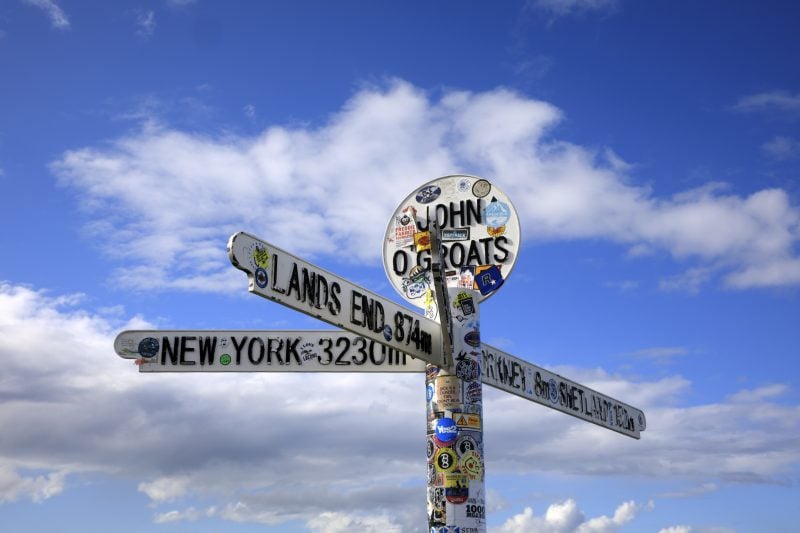 A signpost at John O'Groats pointing to Lands End