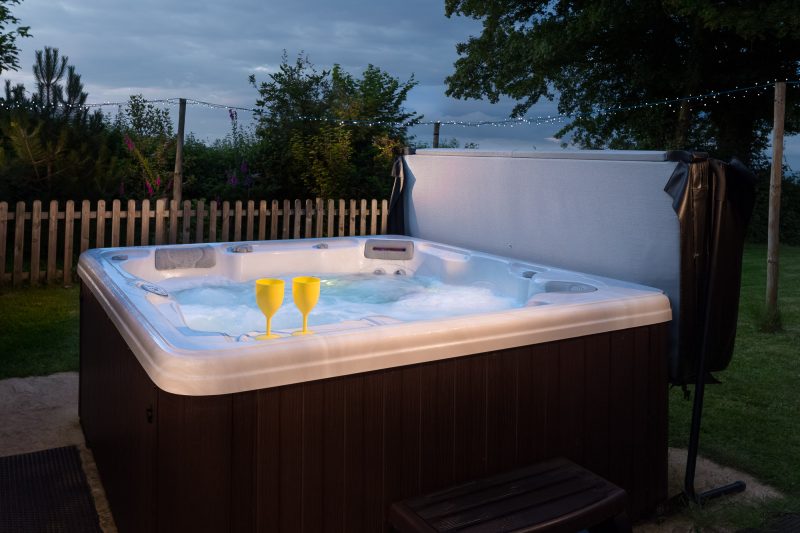 outdoor hot tub near log cabin