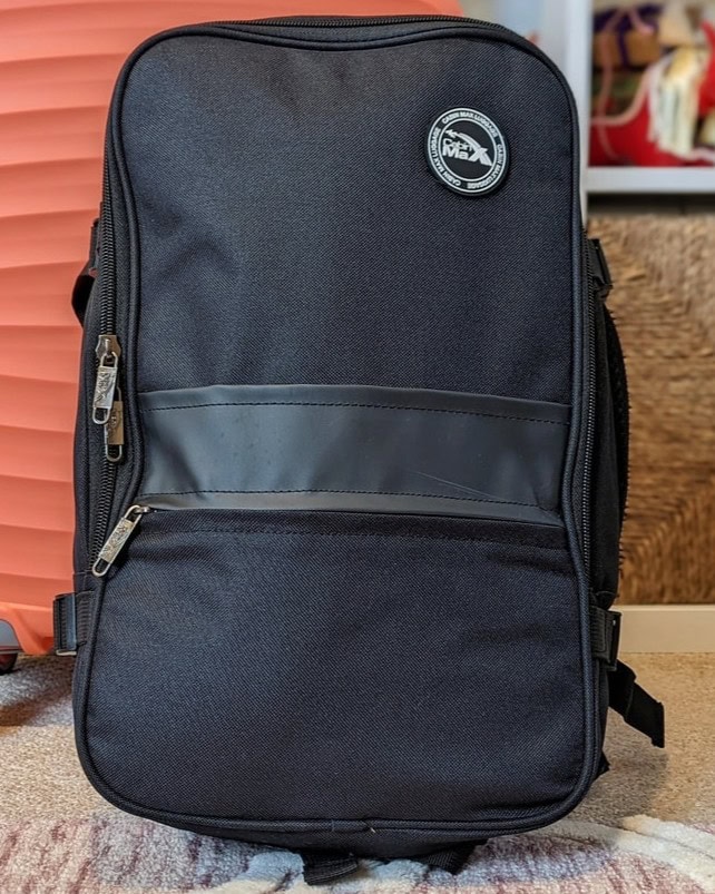 Black backpack with the Cabin Max logo on the top