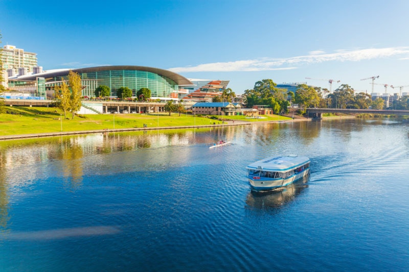 adelaide city centre and a calm river on a sunny day.