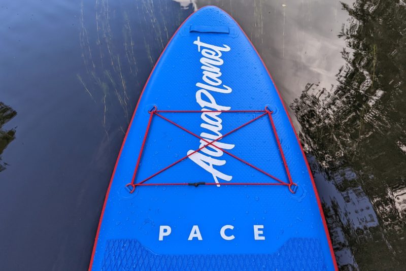 looking down at the front of the aquaplanet pace paddleboard on a river