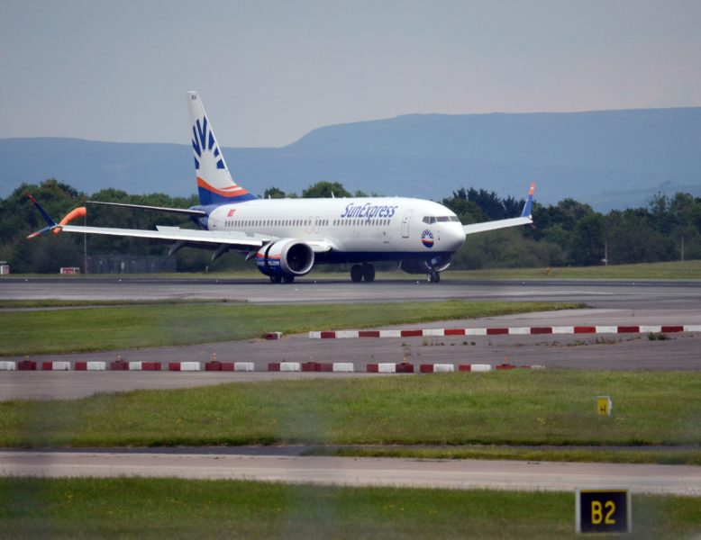 Airplane on the tarmac at Manchester Airport on a grey day