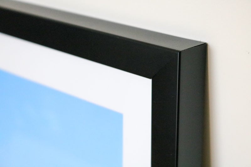 close up of the corner of a black photo frame. MYPICTURE framed photos review.