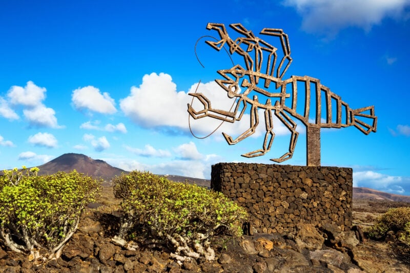 A bronze abstract sculpture of a lobster like creature outside Jameos de agua in Lanzarote