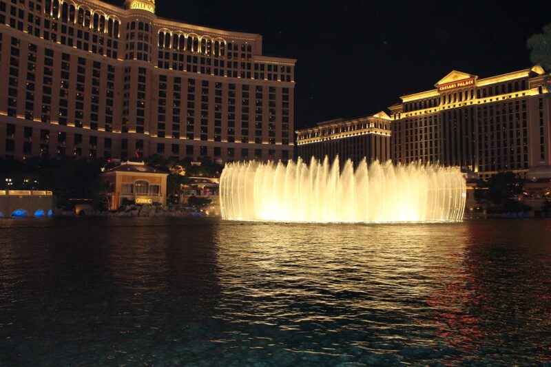 fountains lit up outside the mgm grand hotel in las vegas at night