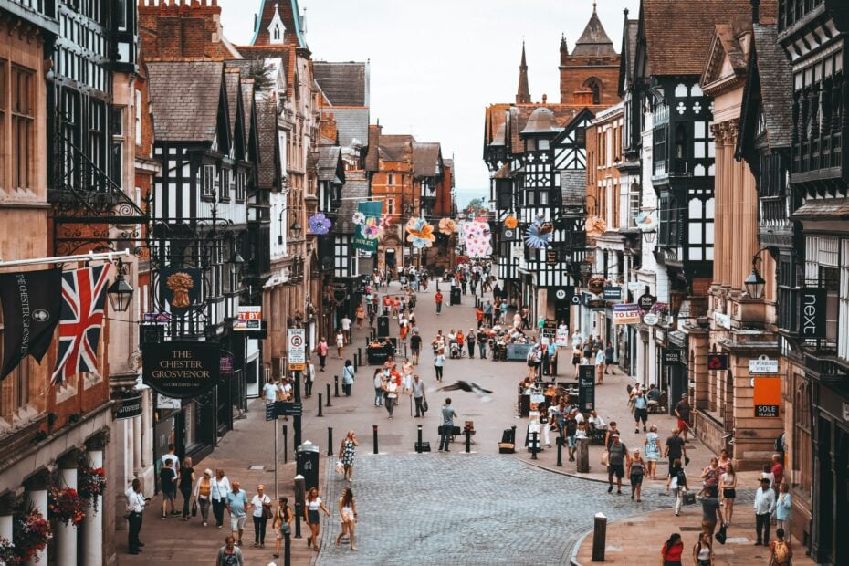 high street in Chester England lined with historic buildings including several white buildings with black painted timber cladding. Lacking internet in the UK is one of the most common challenges first-time visitors face