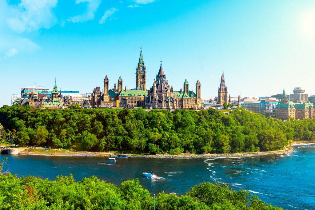 view of the Parliament in Ottawa with a river in front