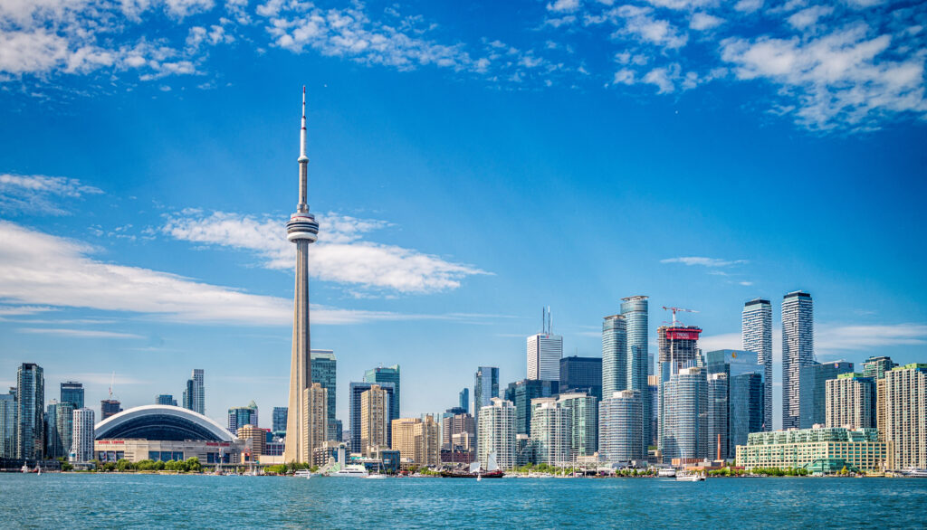 Skyline of Toronto in Canada from the lake Ontario with water in the foreground and skyscrapers