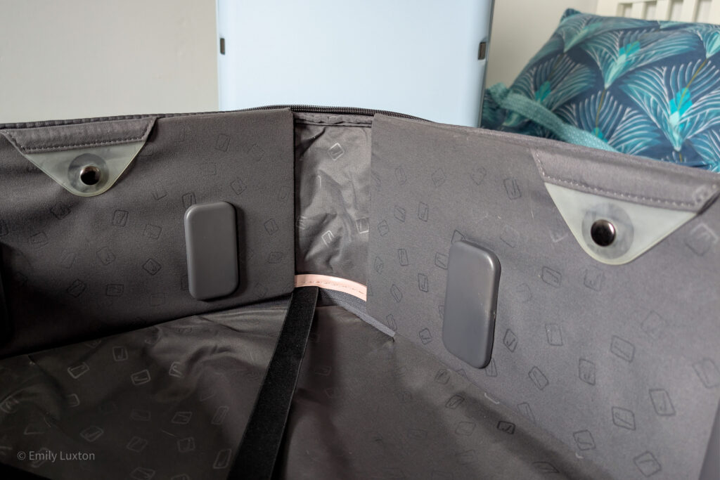 Inside of a suicase with grey fabric