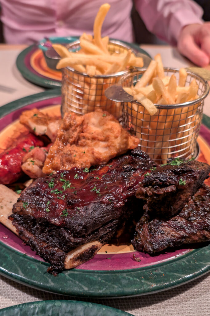 Large plate with fries, sausage, breaded chicken and ribs | Beach House Speciality Restaurant on P&O Iona