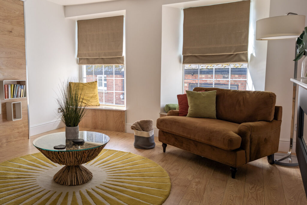 Lounge with a brown suede sofa and 