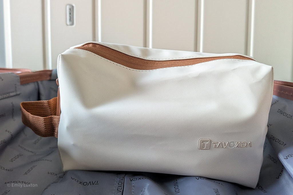 Cream toiletry bag with brown zip and handle